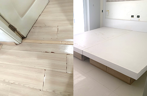 劣化した床やベッドのある室内